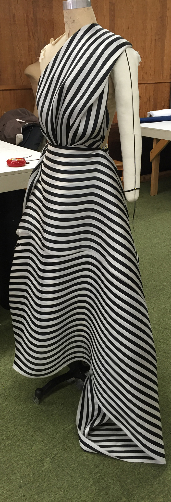 10 yards of continuous black and white silk organza fabric draped over a dress form.