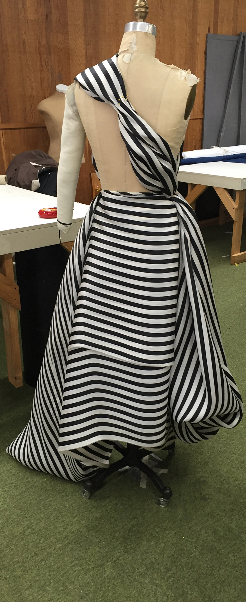 10 yards of continuous black and white silk organza fabric draped over a dress form.