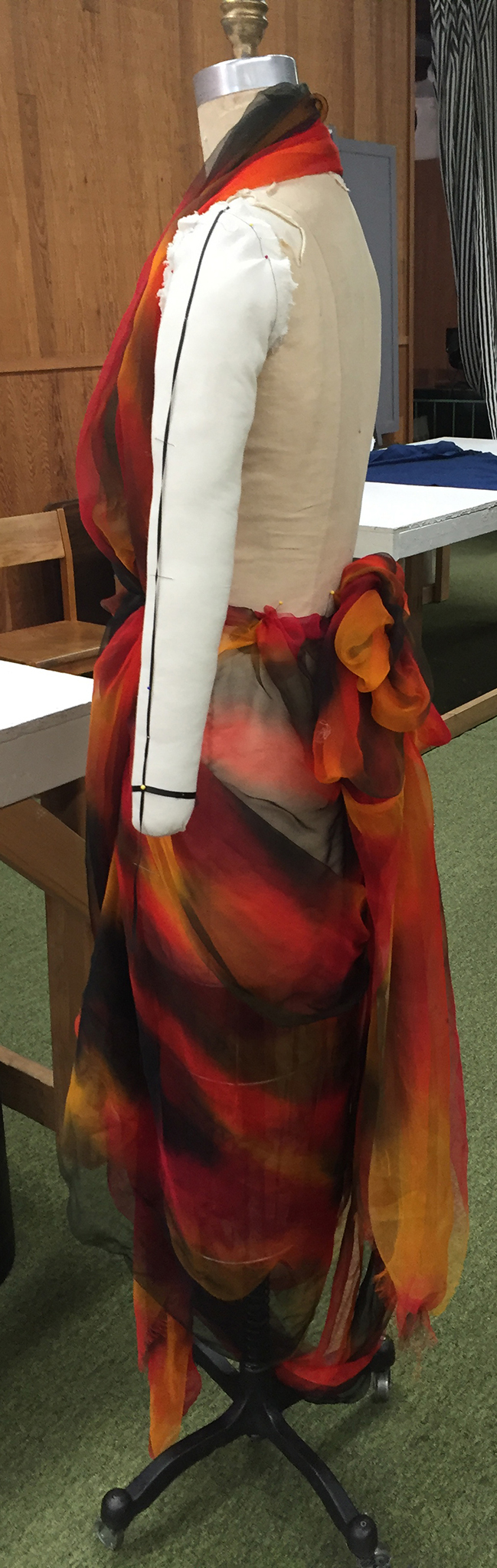 Multicolor silk chiffon draped over a dress form.
