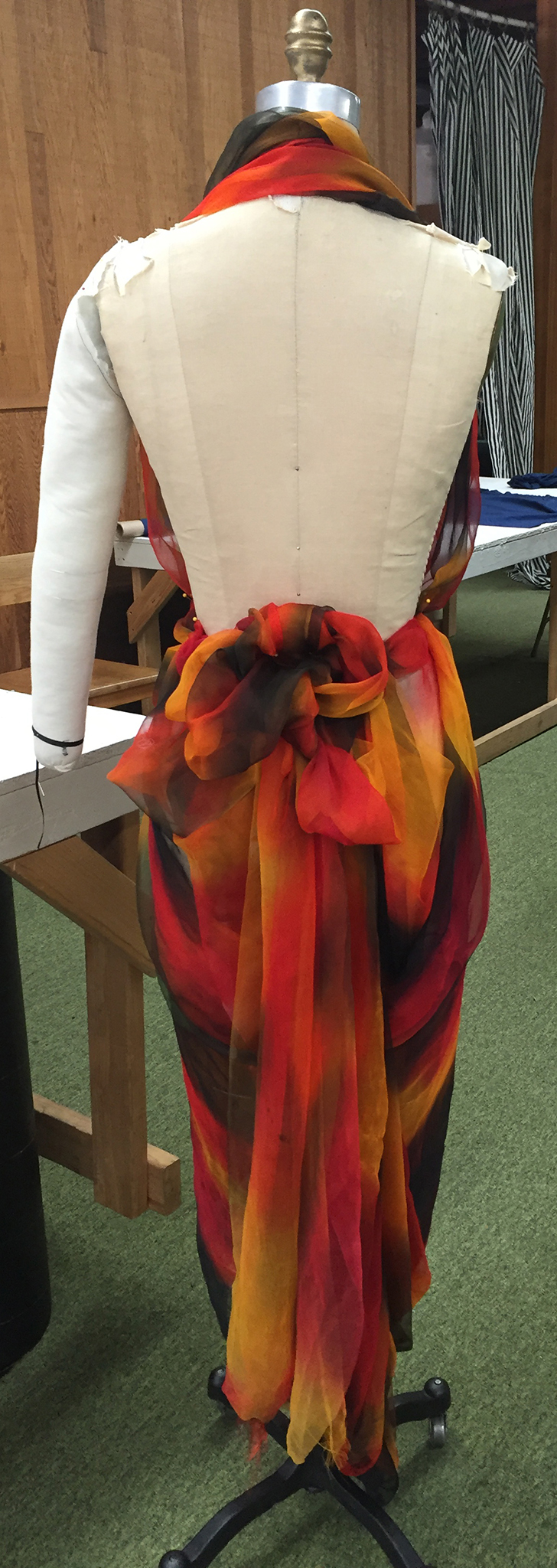Multicolor silk chiffon draped over a dress form.
